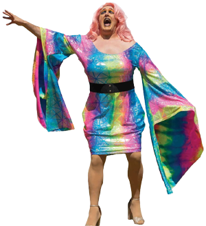 A Pride festival performer sings wearing a multicolored dress and pink hair